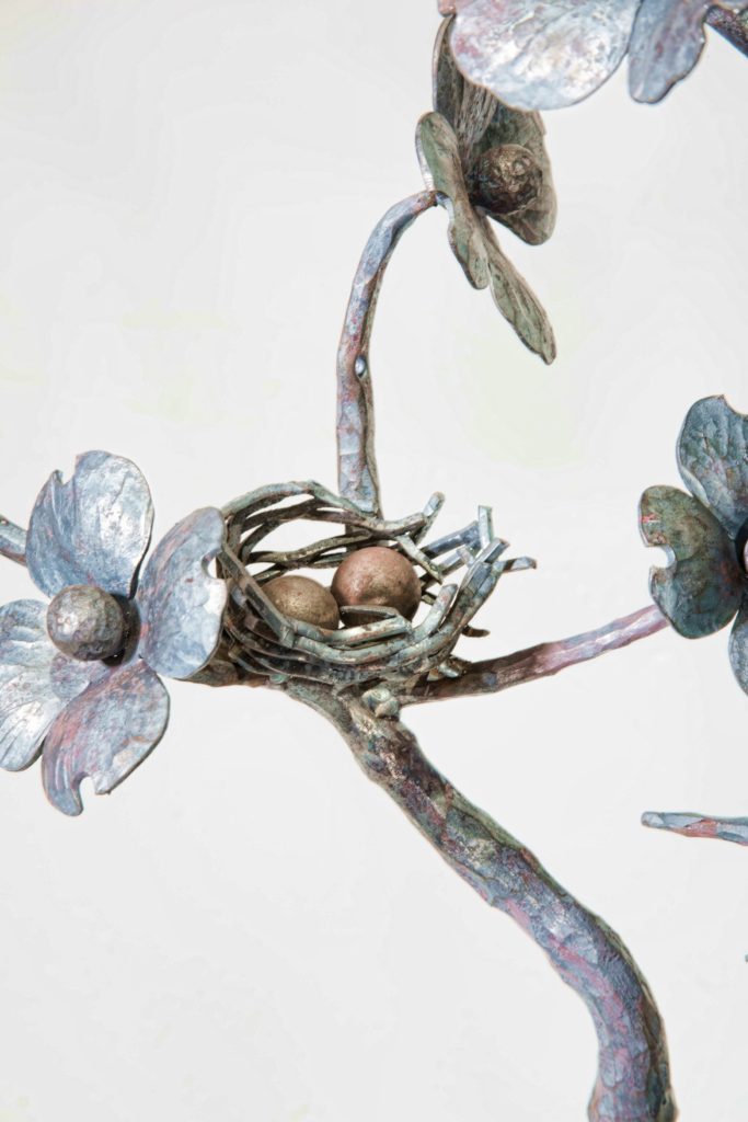 Metal Bird nest and flowers by Antietam Iron Works