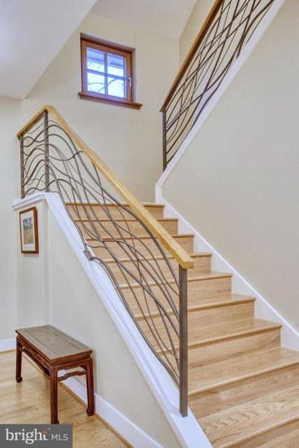 Custom interior metal railings design to flow like water