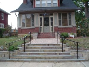 American Craftsman style home with a curved exterior step railing with Post and Cap and scrolls